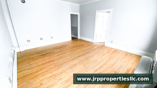 Bright bedroom with hardwood floors