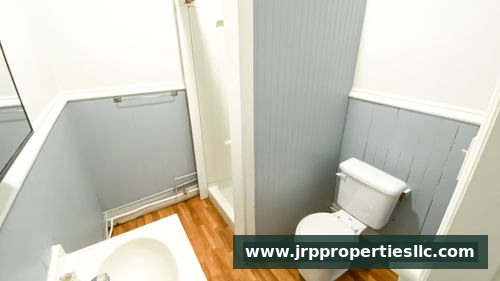 Bathroom with gray wainscoting